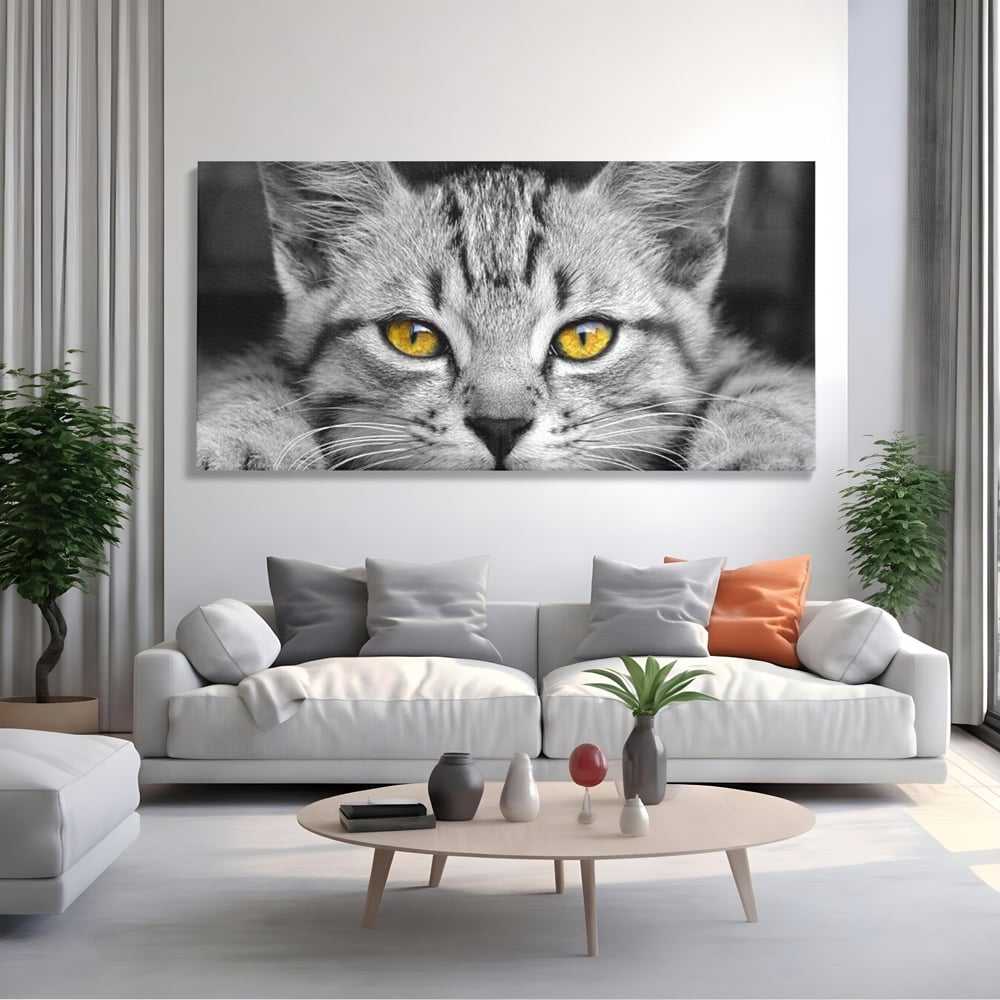 Tablou canvas cu tablou canvas cu o pisica alb-negru si ochi galbeni, fara rama, pe sasiu de lemn, pe perete intr-un living